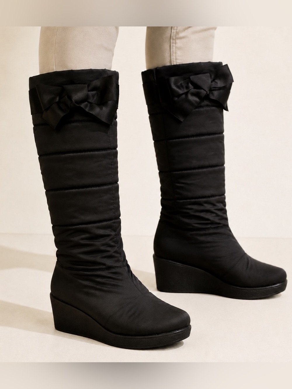 Kate Spade New York Women’s Black Puffer Wedge Boots